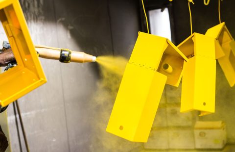 Powder coating metals to yellow colour