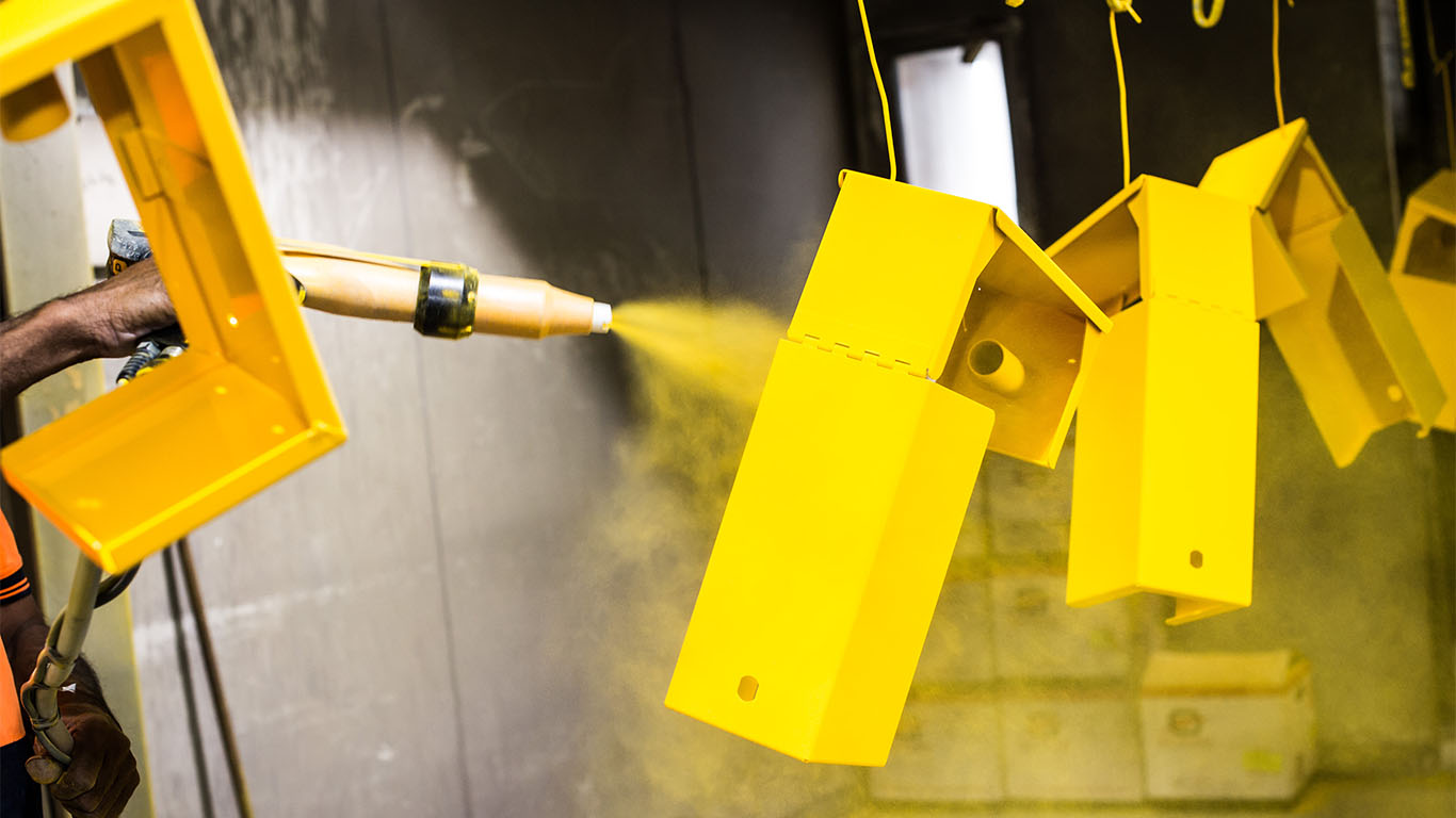 Powder coating metals to yellow colour